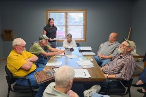 Knox County Public Water Supply District No. 1 Clerk Anngella Willard reads anonymous letters containing allegations about District 5 board member Mark Hunolt during the district's June 15 board meeting in Knox City. No evidence supporting the allegations was presented during the meeting. Photo by Echo Menges