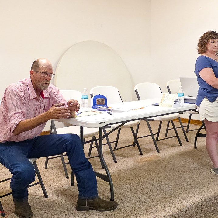 Tom Boatman (left) and Julie Green lead a citizen town hall meeting on Wednesday, July 8, at the Hurdland Community Center to discuss transparency, governance and accountability within the Knox County Public Water Supply District No. 1. Green, who initiated a citizen petition requesting a Missouri State Auditor audit of the district, outlined concerns she said prompted the petition while encouraging residents to stay engaged in the process. Photo by Echo Menges