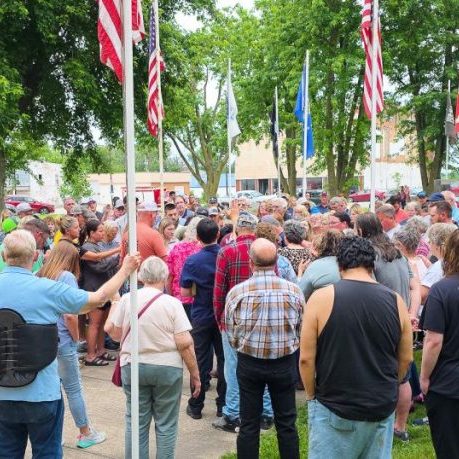 COMMUNITY SUPPORT — Community members gather closely around the Watts family near the conclusion of Saturday evening’s prayer vigil for missing Edina woman Lindsey Watts on the Knox County Courthouse lawn in Edina. Hundreds attended the vigil as the search for Watts continued into the weekend. Photo by Echo Menges