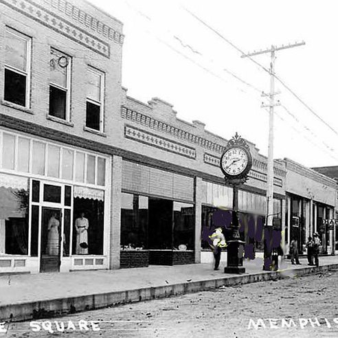 CLOCK ON THE SQUARE: The historic Ansonia street clock stands in front of McLane Jewelry Store on the south side of the Memphis square in this photograph taken around 1920. W.B. McLane purchased the clock from Odell Jewelers in Quincy, Illinois, around 1918 and had it shipped to Memphis. (Photo courtesy of the National Association of Watch and Clock Collectors Museum)
