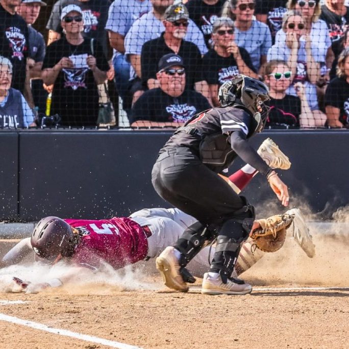 Colin Oliver makes a dramatic dive across the plate in Schuyler County’s quarterfinal game against Eugene. Photo by Brenda Linder.