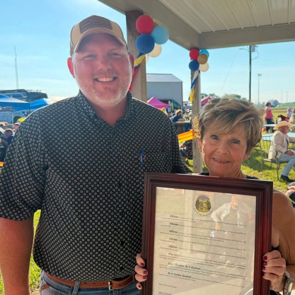 Lois Pinson, legislative assistant to state Sen. Cindy O’Laughlin, presents a Missouri Senate resolution to Schuyler County Nursing Home District Board President Ryan Bushnell during the facility’s 50th anniversary celebration Sunday, July 12. The resolution recognized the nursing home’s five decades of compassionate care and service to Schuyler County residents.